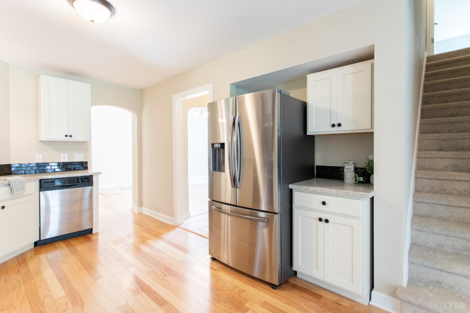 549 Thrashers Creek Road Amherst, VA 24521 - Photo 16 of 66 a kitchen with a refrigerator and a stove top oven