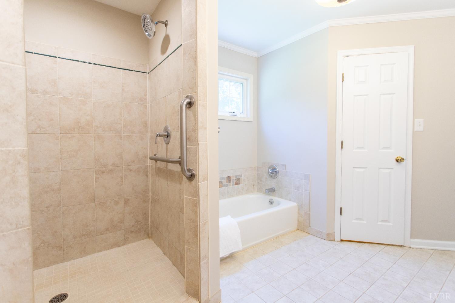 549 Thrashers Creek Road Amherst, VA 24521 - Photo 29 of 66 a bathroom with a bathtub and a shower
