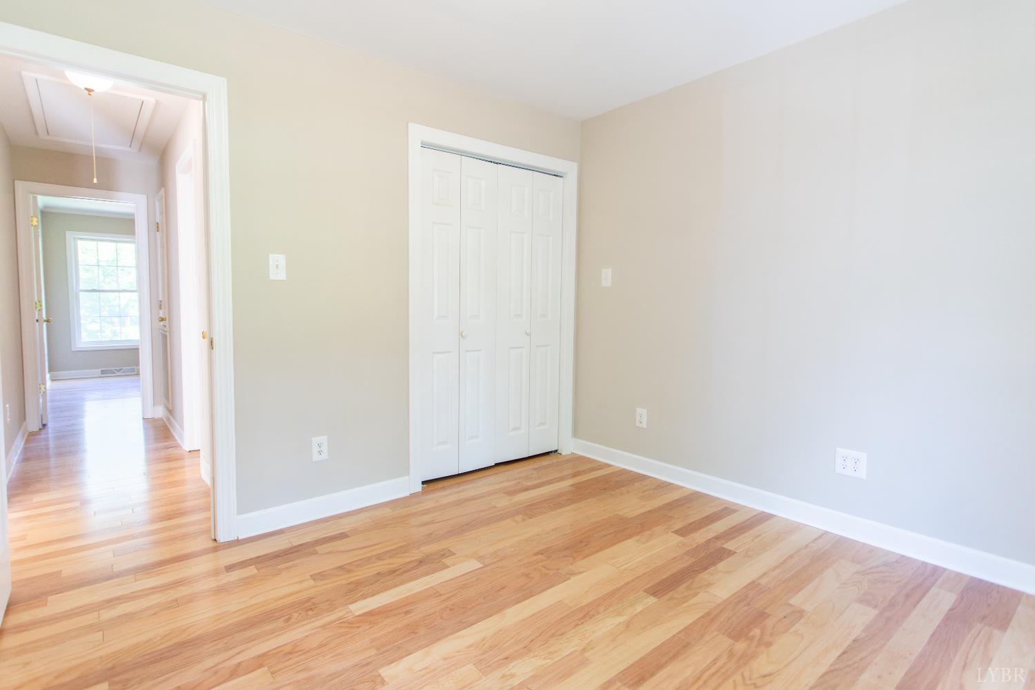 549 Thrashers Creek Road Amherst, VA 24521 - Photo 32 of 66 a view of an empty room with wooden floor