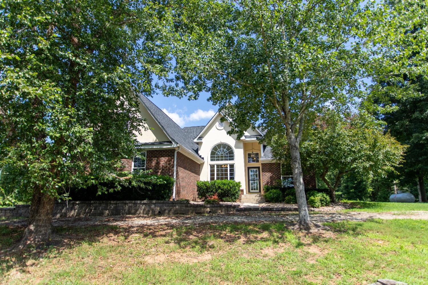 549 Thrashers Creek Road Amherst, VA 24521 - Photo 50 of 66 a front view of a house with a yard garage and outdoor seating
