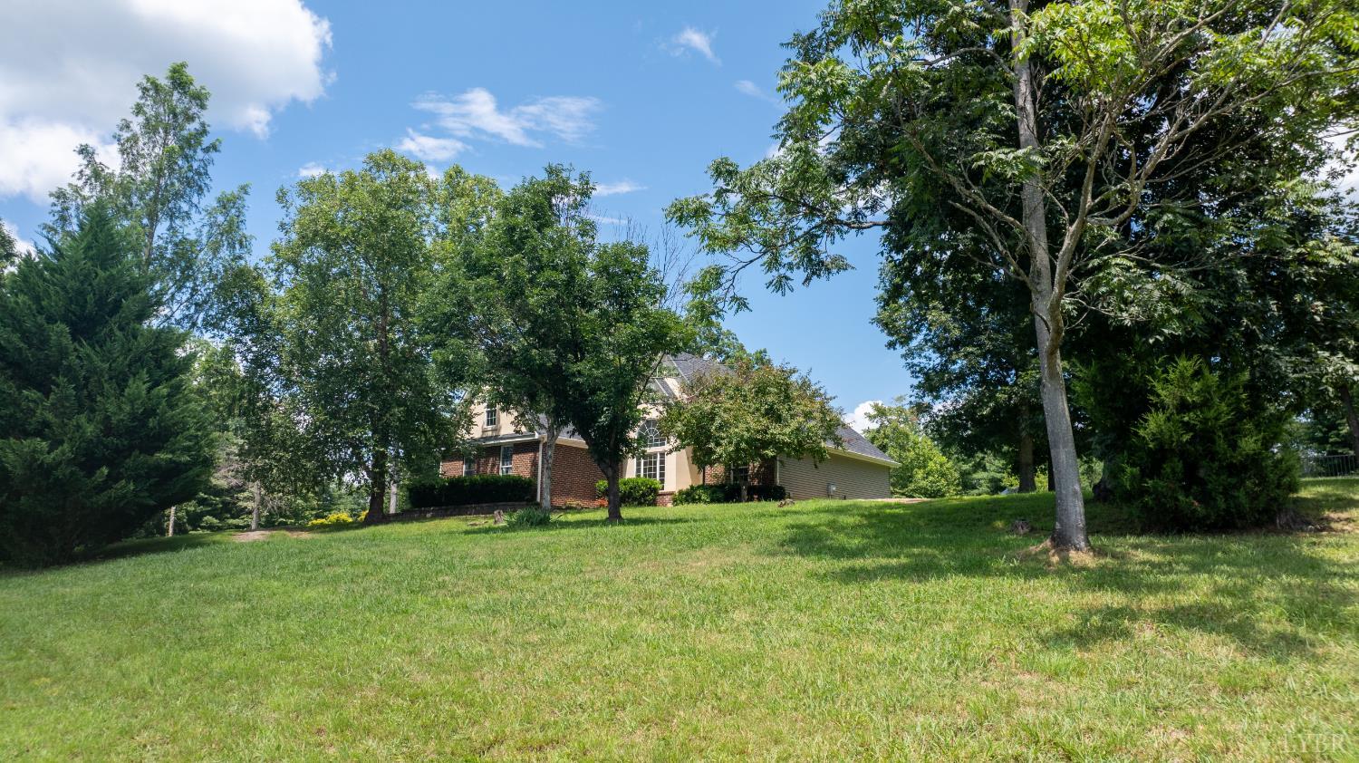 549 Thrashers Creek Road Amherst, VA 24521 - Photo 59 of 66 a house with a tree in front of it