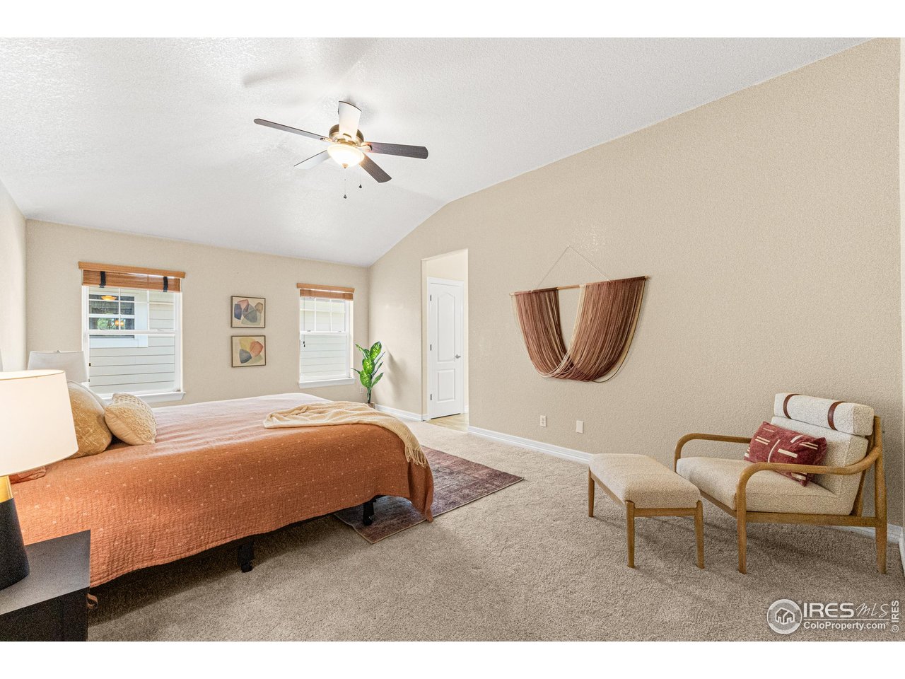 6495 Eagle Shadow Avenue Brighton, CO 80602 - Photo 18 of 40 a bedroom with a bed and window