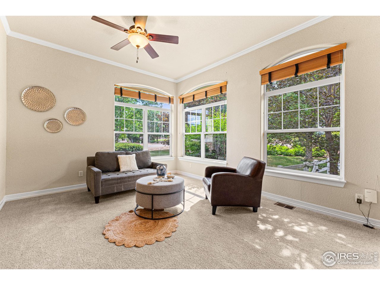 6495 Eagle Shadow Avenue Brighton, CO 80602 - Photo 6 of 40 a living room with furniture and a large window