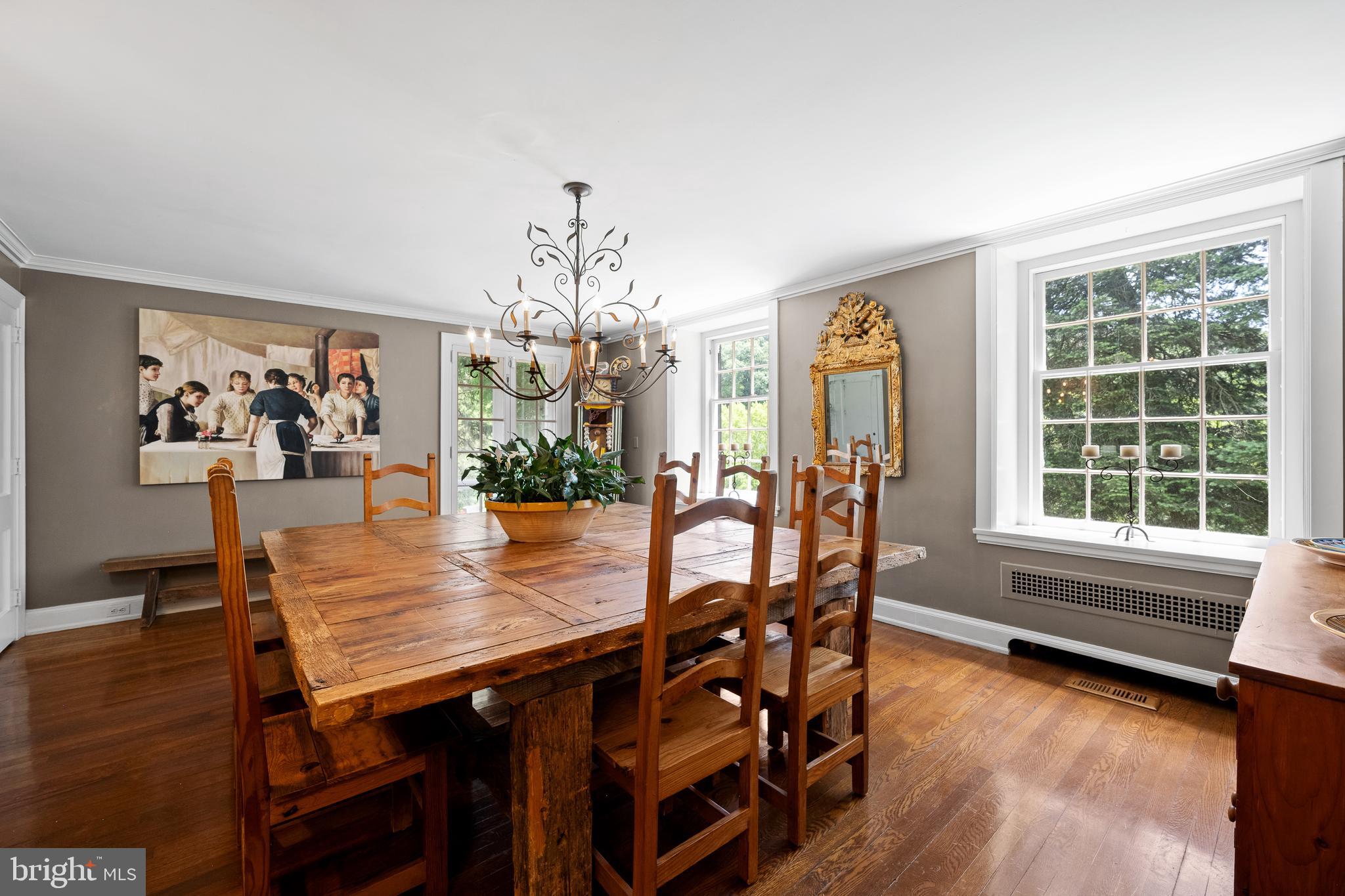 1740 Lenape Road West Chester, PA 19382 - Photo 22 of 91 a view of a dining room with furniture a chandelier and wooden floor