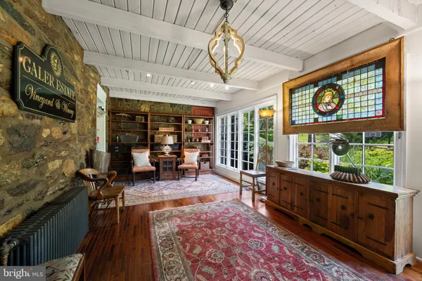 a hallway with front door wooden floor and a window