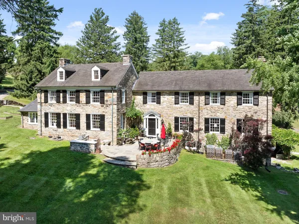 a view of house with yard and garden