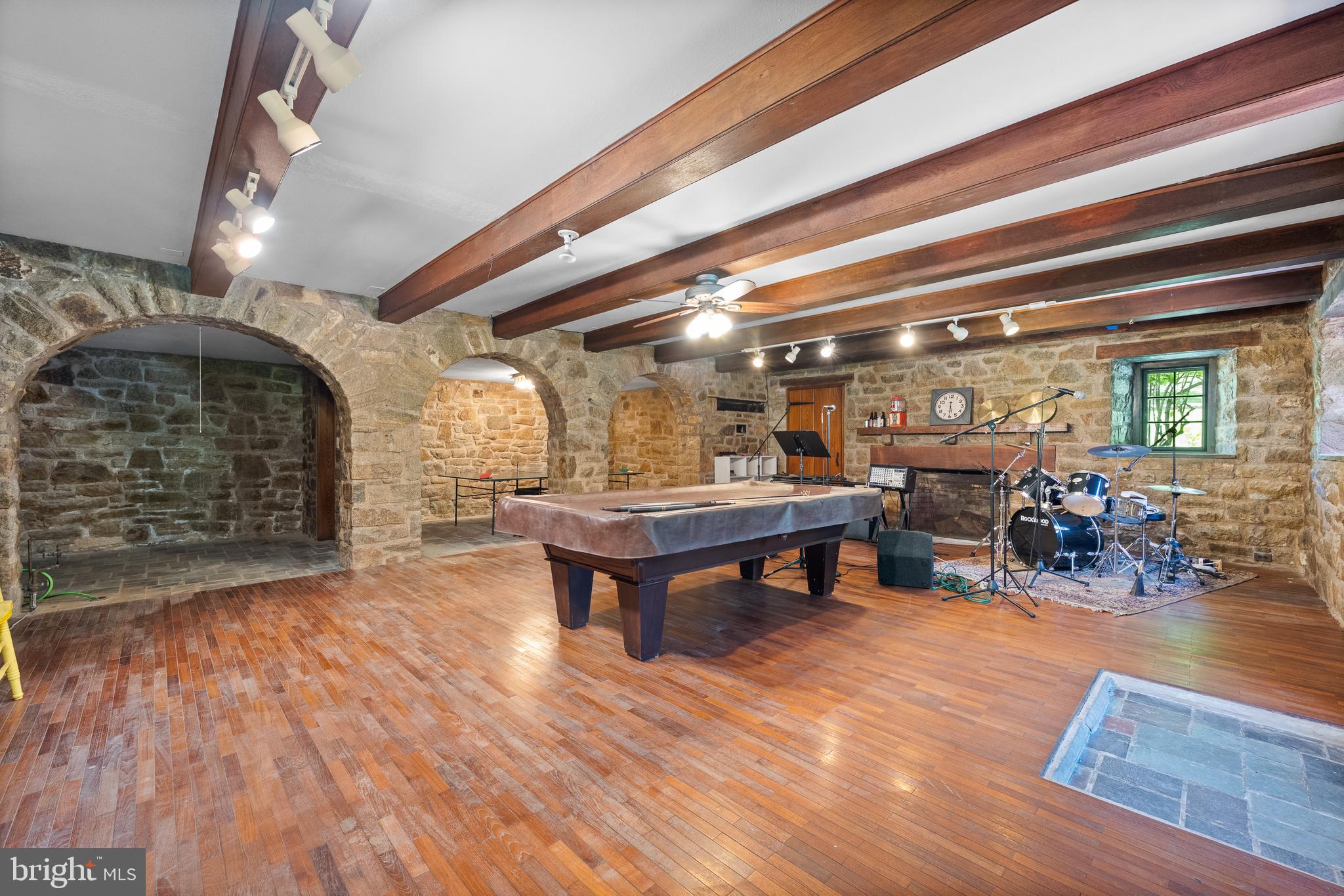 1740 Lenape Road West Chester, PA 19382 - Photo 47 of 91 a room with lots of wooden furniture and a wooden floors