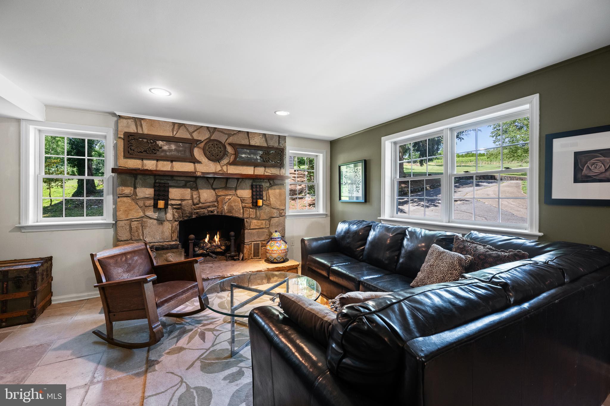1740 Lenape Road West Chester, PA 19382 - Photo 68 of 91 a living room with furniture and a fireplace