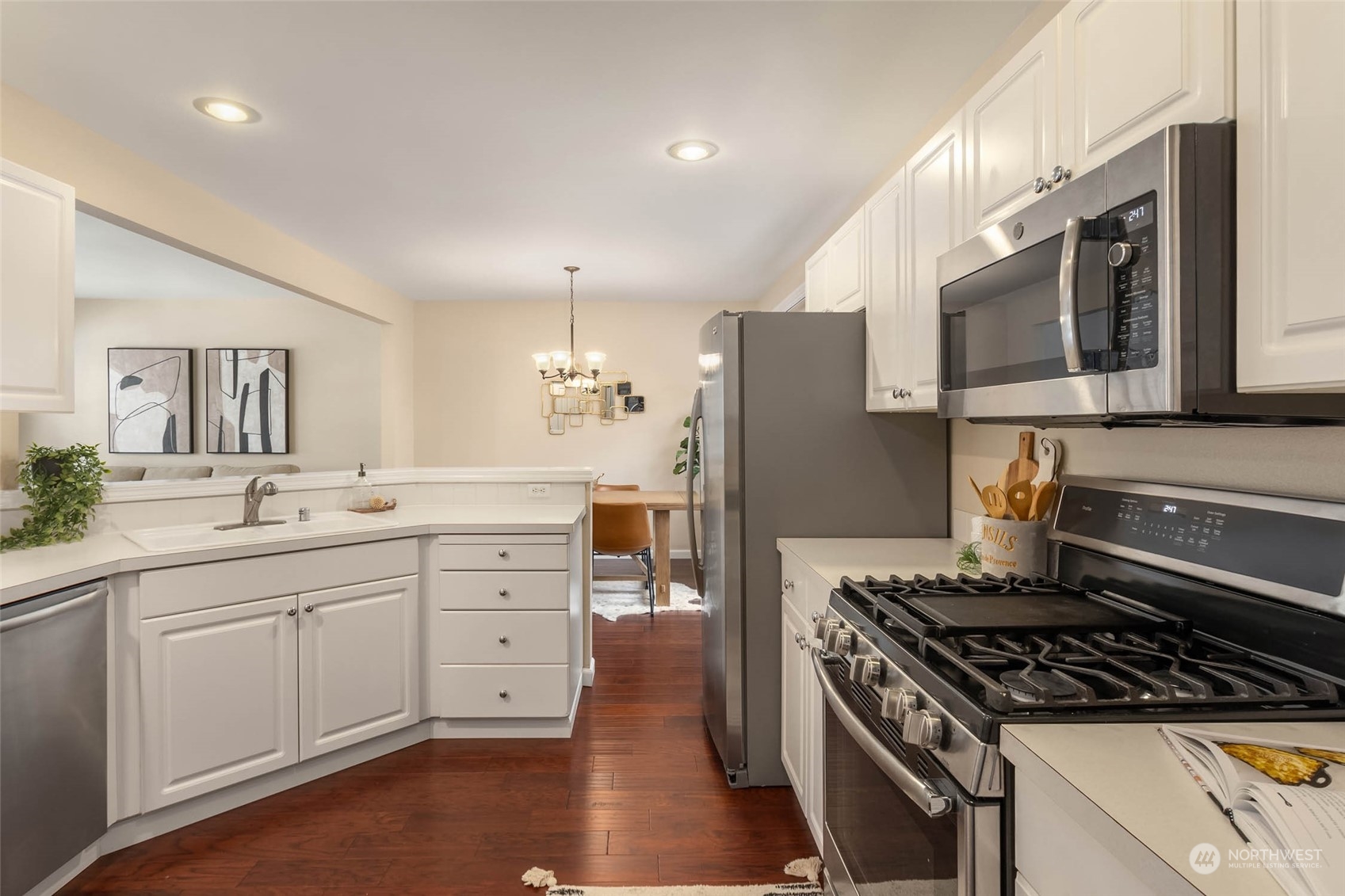 3910 Northeast 5th Place Renton, WA 98056 - Photo 12 of 27 a kitchen with white cabinets and appliances