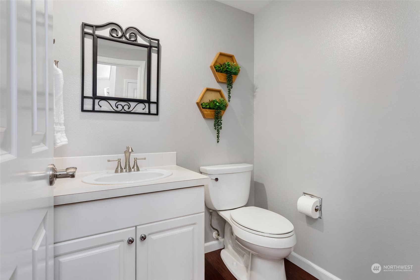 3910 Northeast 5th Place Renton, WA 98056 - Photo 14 of 27 a bathroom with a toilet sink and mirror