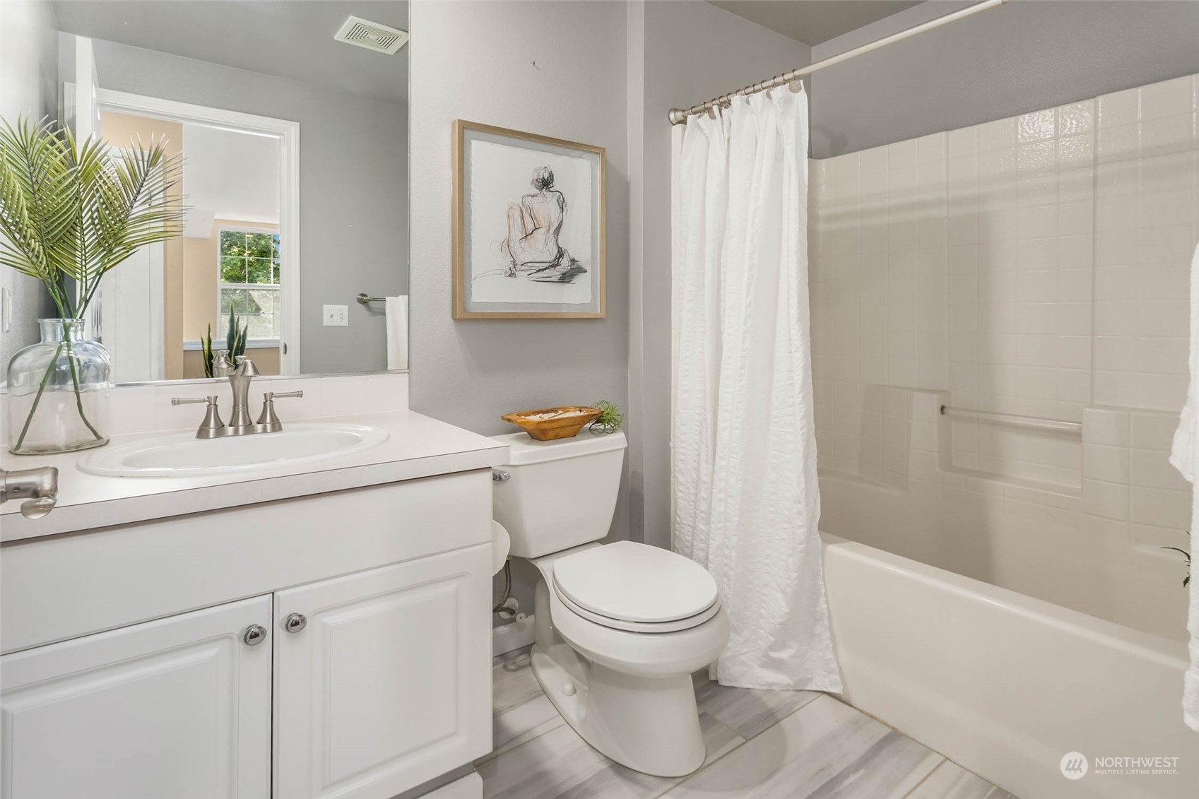 3910 Northeast 5th Place Renton, WA 98056 - Photo 19 of 27 a bathroom with a sink toilet and shower