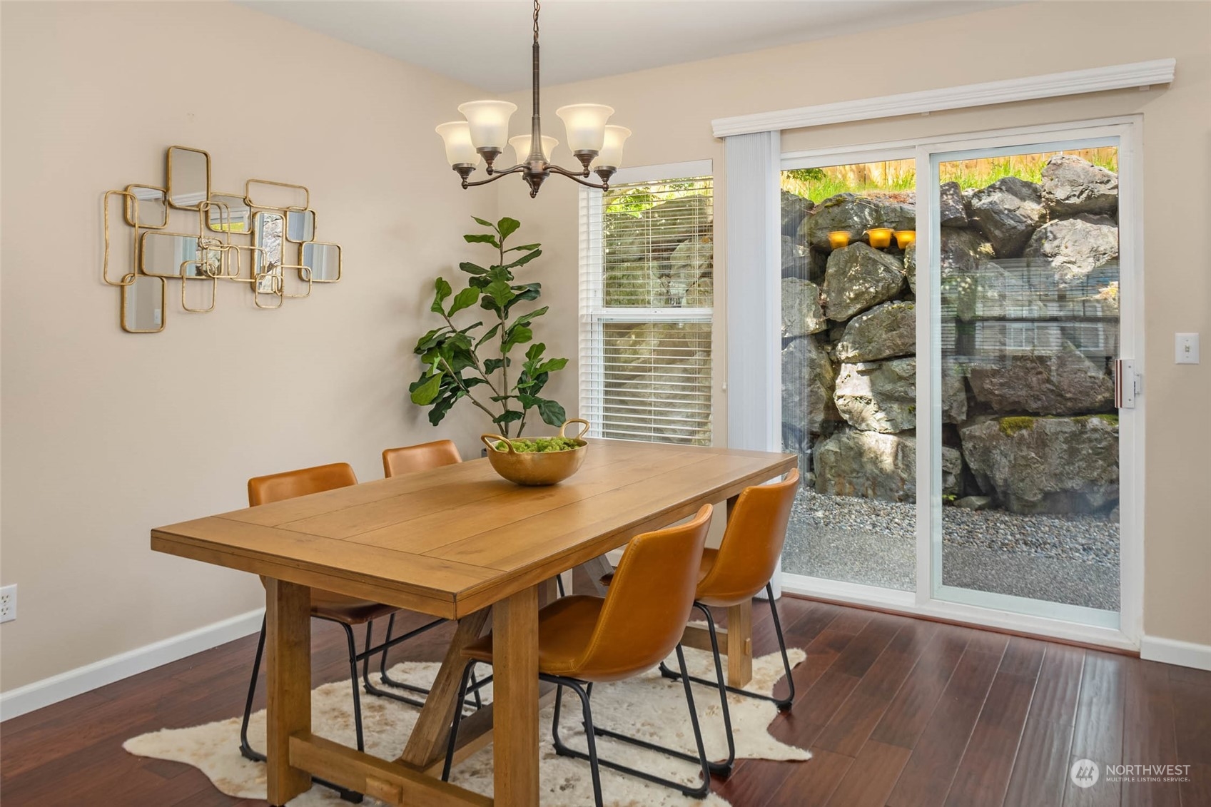 3910 Northeast 5th Place Renton, WA 98056 - Photo 7 of 27 a view of a dining room with furniture wooden floor and chandelier