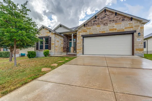 a house view with a garden space