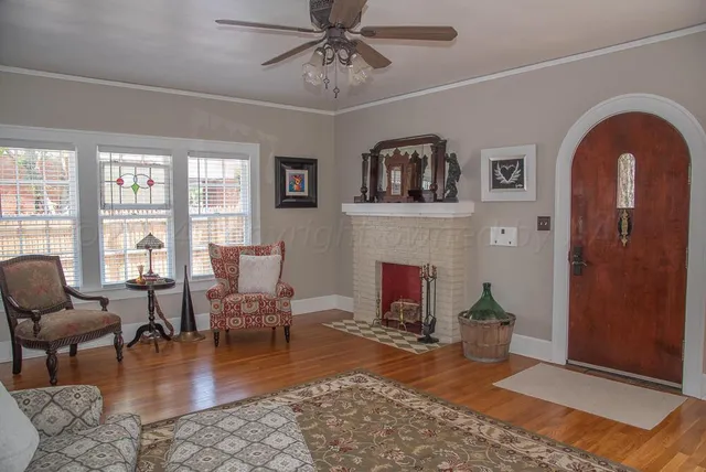 a view of a kitchen with stainless steel appliances granite countertop a stove a sink and a microwave