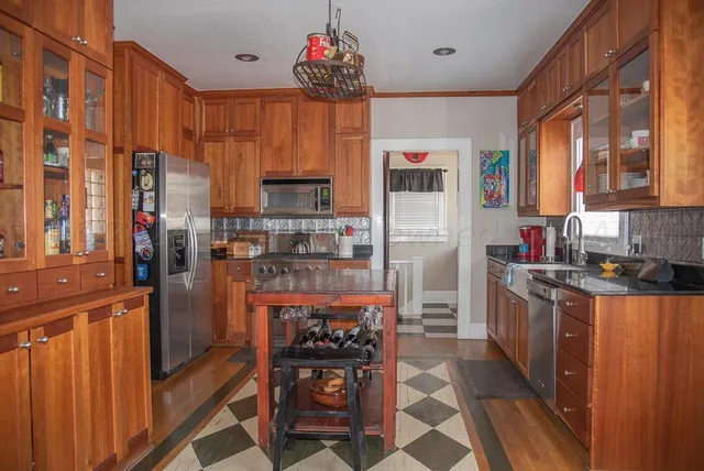 a bathroom with a sink toilet and a mirror