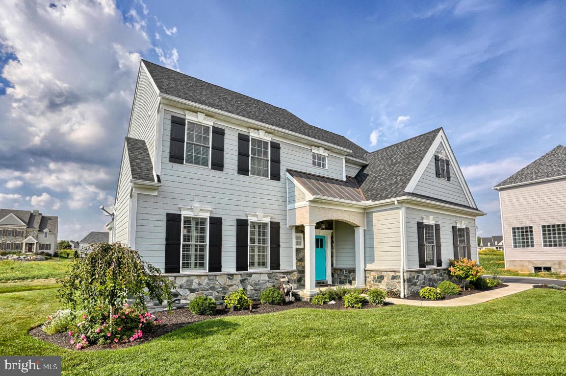 698 Warminster Lane Lititz, PA 17543 - Photo 1 of 49 a front view of a house with garden and porch