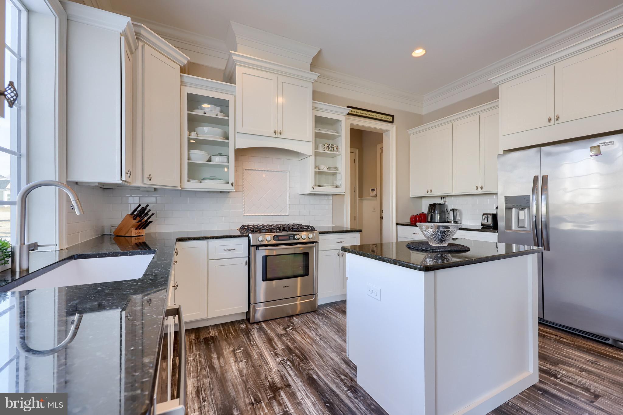 698 Warminster Lane Lititz, PA 17543 - Photo 11 of 49 a kitchen with stainless steel appliances granite countertop a sink stove and refrigerator