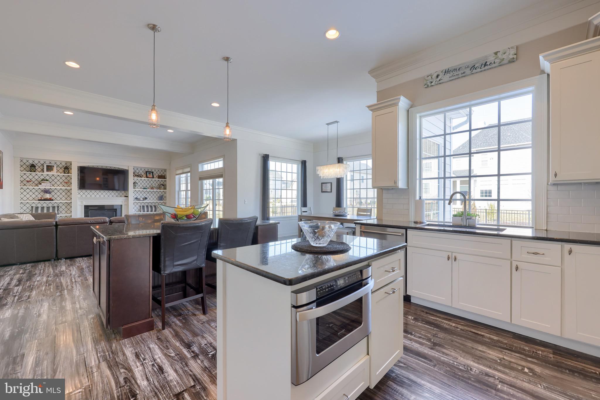 698 Warminster Lane Lititz, PA 17543 - Photo 14 of 49 a kitchen that has a sink a stove and a table in it