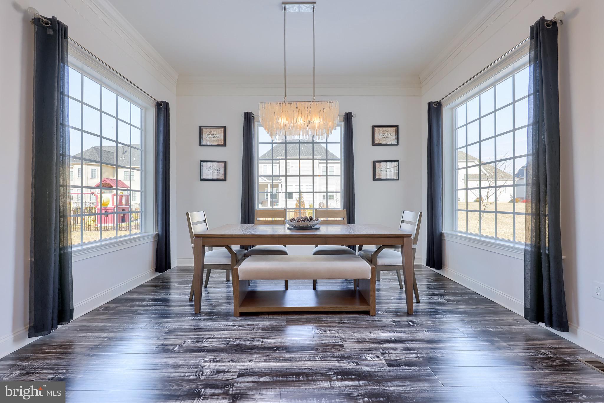 698 Warminster Lane Lititz, PA 17543 - Photo 18 of 49 a view of a dining room with furniture windows and wooden floor