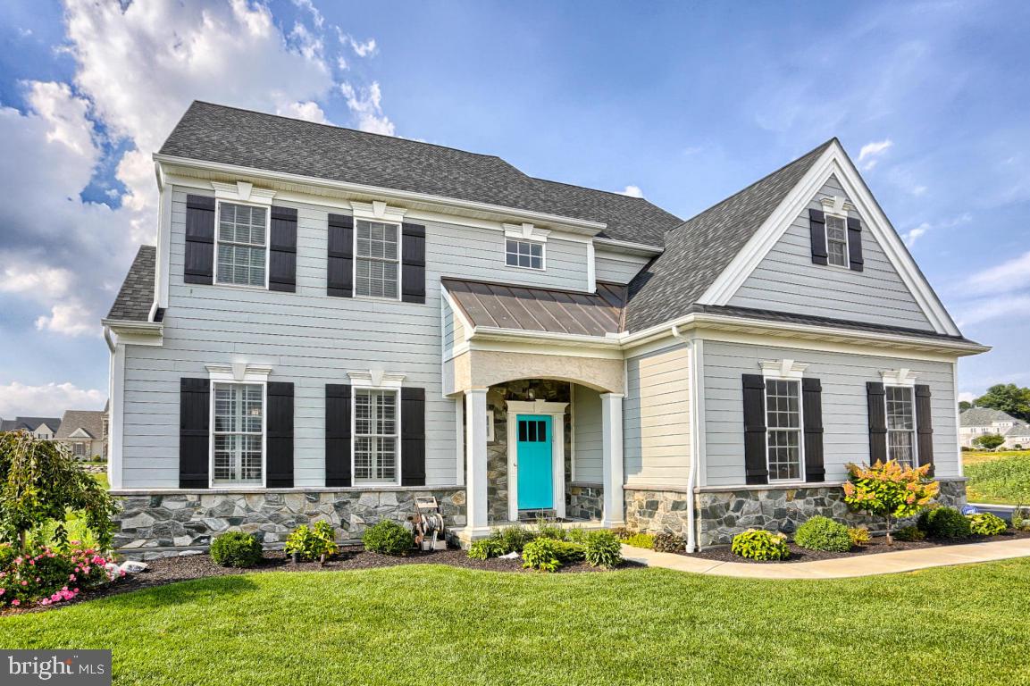 698 Warminster Lane Lititz, PA 17543 - Photo 2 of 49 a front view of a house with garden