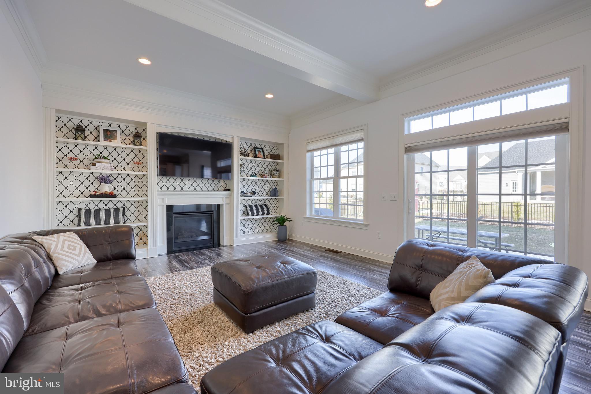 698 Warminster Lane Lititz, PA 17543 - Photo 24 of 49 a living room with furniture fireplace and a large window