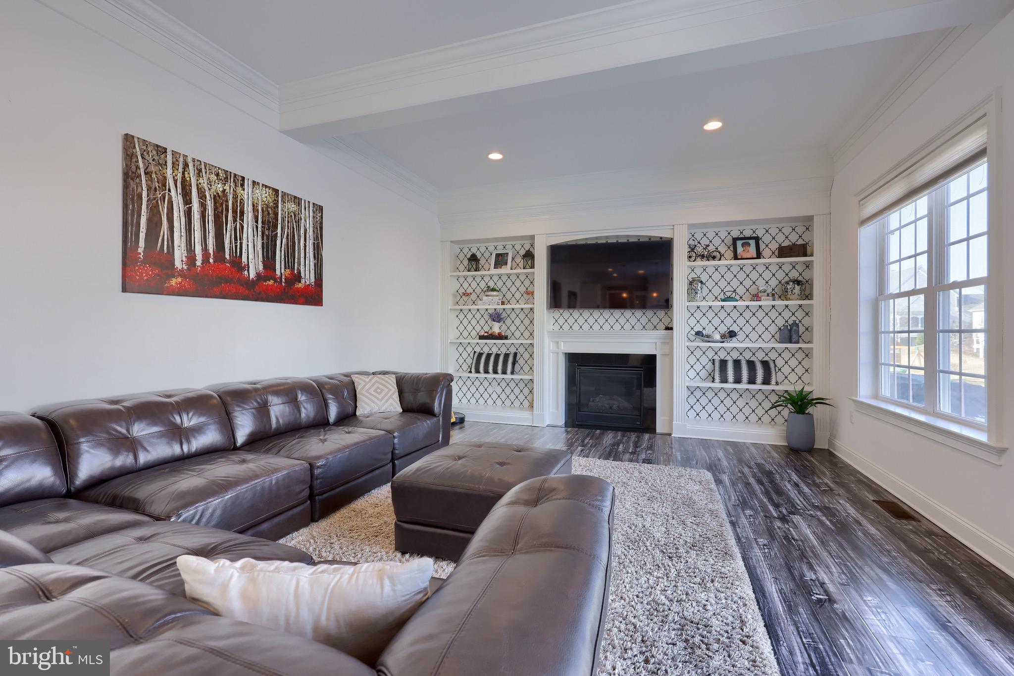 698 Warminster Lane Lititz, PA 17543 - Photo 25 of 49 a living room with furniture a flat screen tv and a fireplace