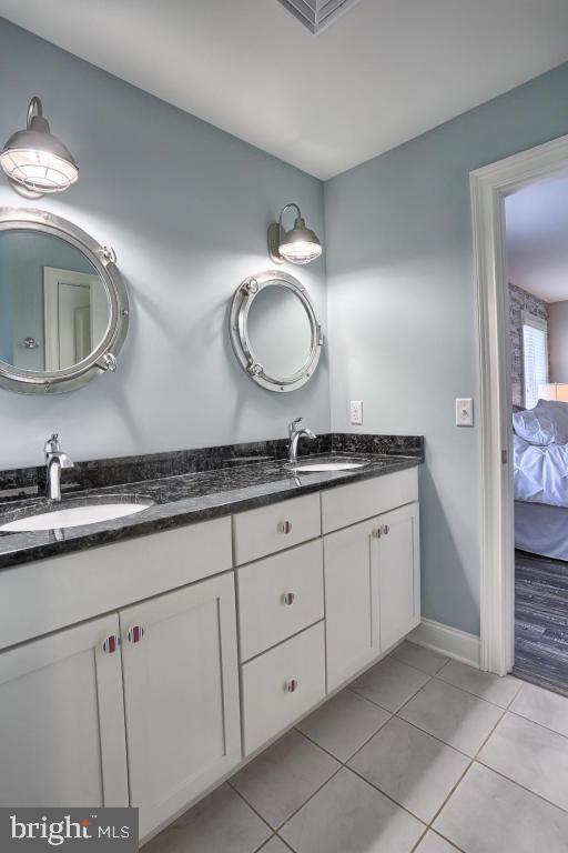 698 Warminster Lane Lititz, PA 17543 - Photo 31 of 49 a bathroom with a granite countertop sink and a mirror