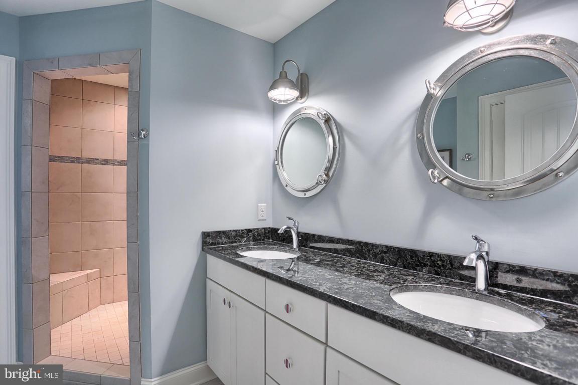 698 Warminster Lane Lititz, PA 17543 - Photo 32 of 49 a bathroom with a granite countertop double vanity sink and a mirror