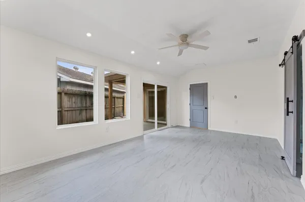 a view of an empty room with a window