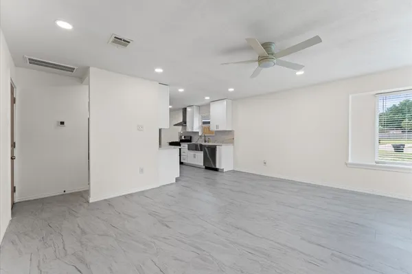 a view of a kitchen with a sink and a window