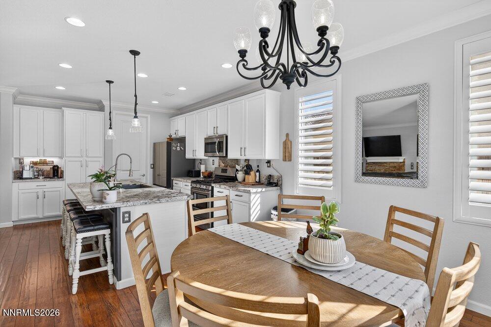 1473 Hogadon Way Reno, NV 89523 - Photo 15 of 40 a kitchen with a dining table chairs workspace and a window