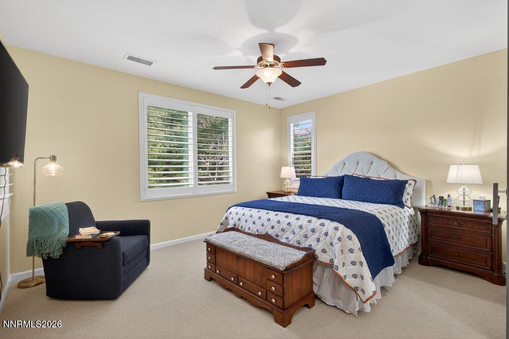 1473 Hogadon Way Reno, NV 89523 - Photo 16 of 40 a spacious bedroom with a bed and a couch