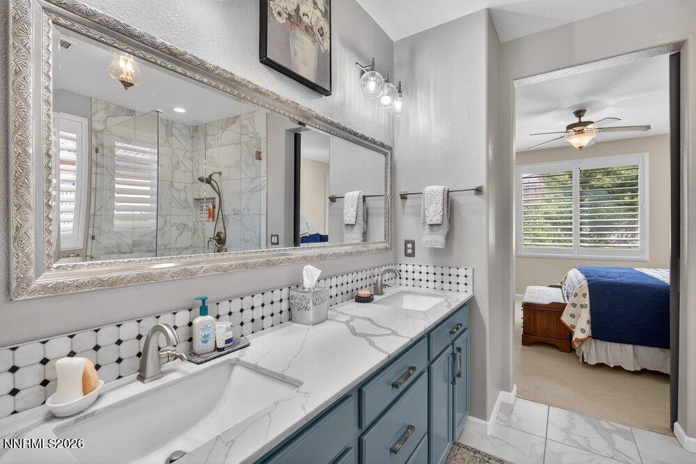 1473 Hogadon Way Reno, NV 89523 - Photo 20 of 40 a spacious bathroom with a shower a sink and a mirror