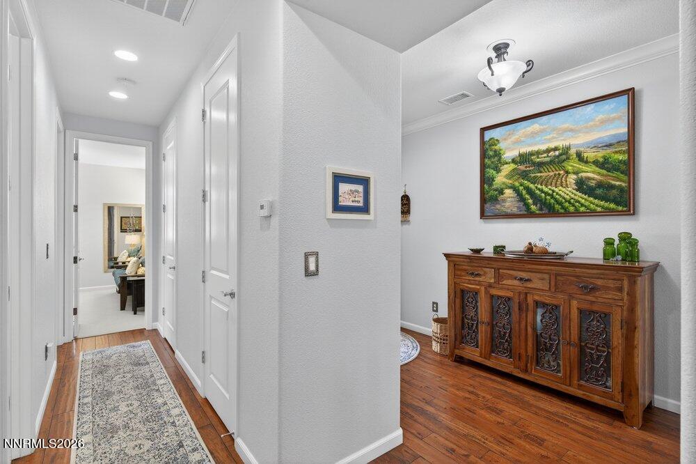 1473 Hogadon Way Reno, NV 89523 - Photo 21 of 40 a view of a hallway view with three couches and a flat screen tv