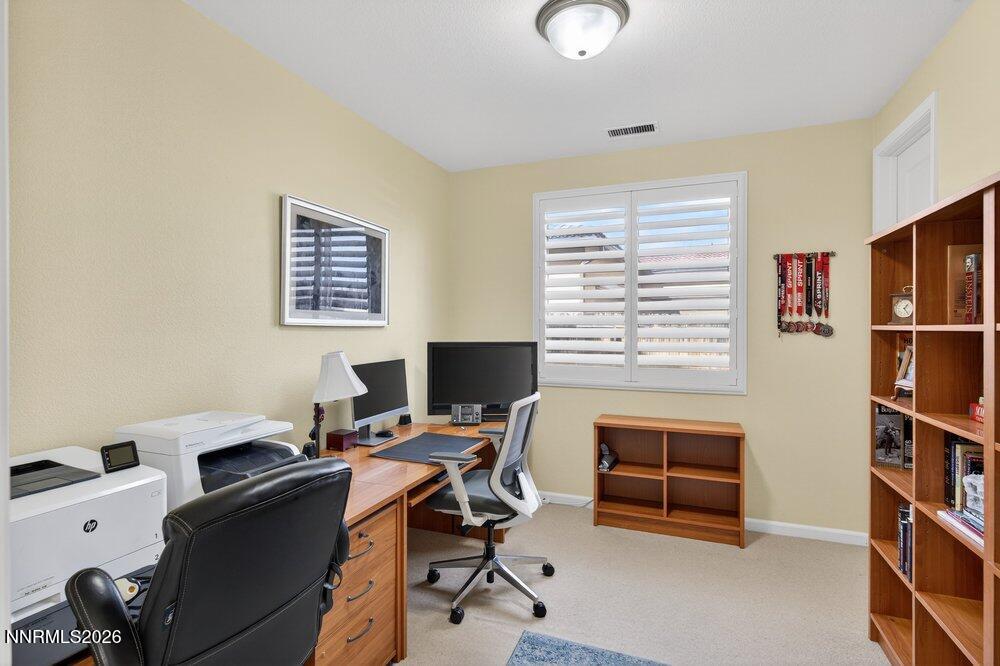 1473 Hogadon Way Reno, NV 89523 - Photo 23 of 40 a view of a workspace with furniture and a window