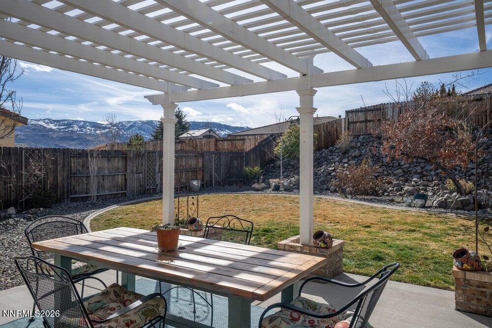 1473 Hogadon Way Reno, NV 89523 - Photo 29 of 40 a view of a patio with table and chairs and wooden floor