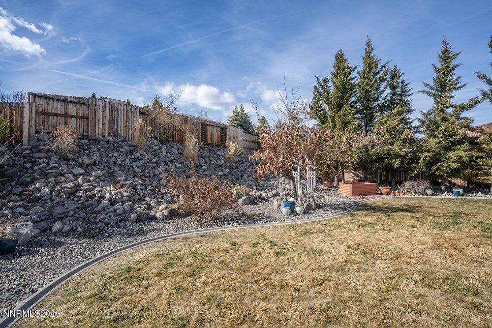 1473 Hogadon Way Reno, NV 89523 - Photo 32 of 40 a view of a yard with plants and trees