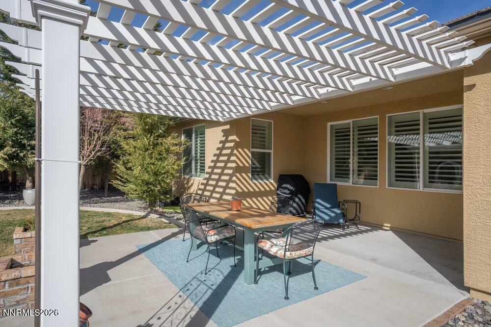 1473 Hogadon Way Reno, NV 89523 - Photo 36 of 40 a view of a chairs and table in the patio with a barbeque grill