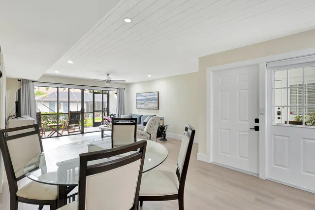 a view of a dining room with furniture and window