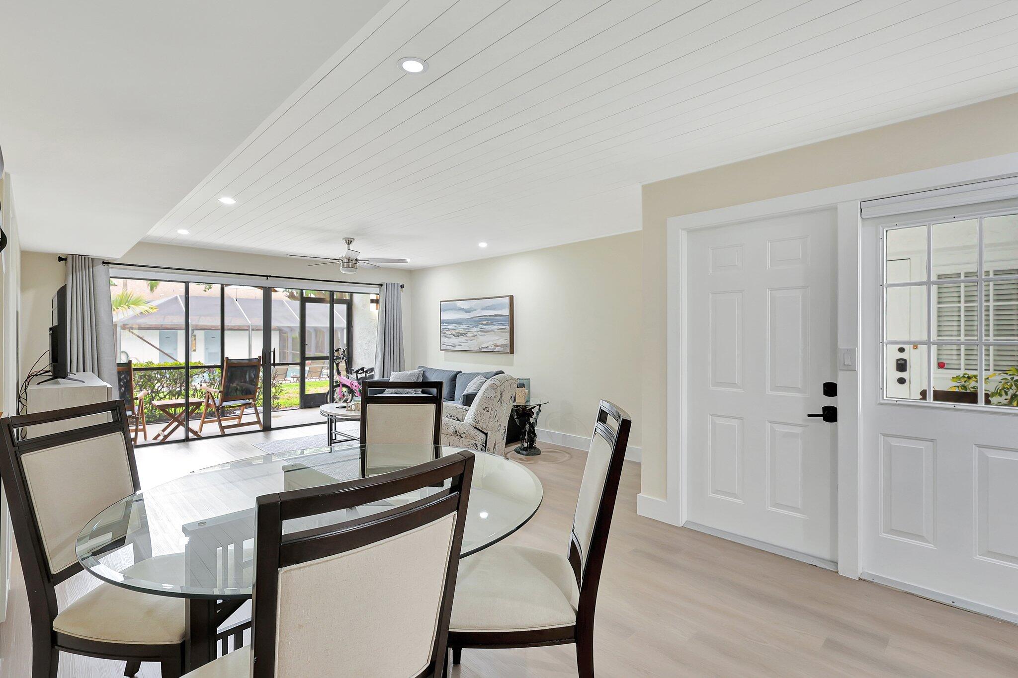 4885 Southeast Capstan Avenue, Unit 21 Stuart, FL 34997 - Photo 4 of 14 a view of a dining room with furniture and window