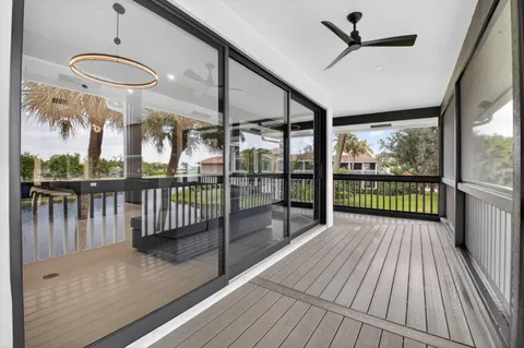 a balcony with wooden floor and outdoor space