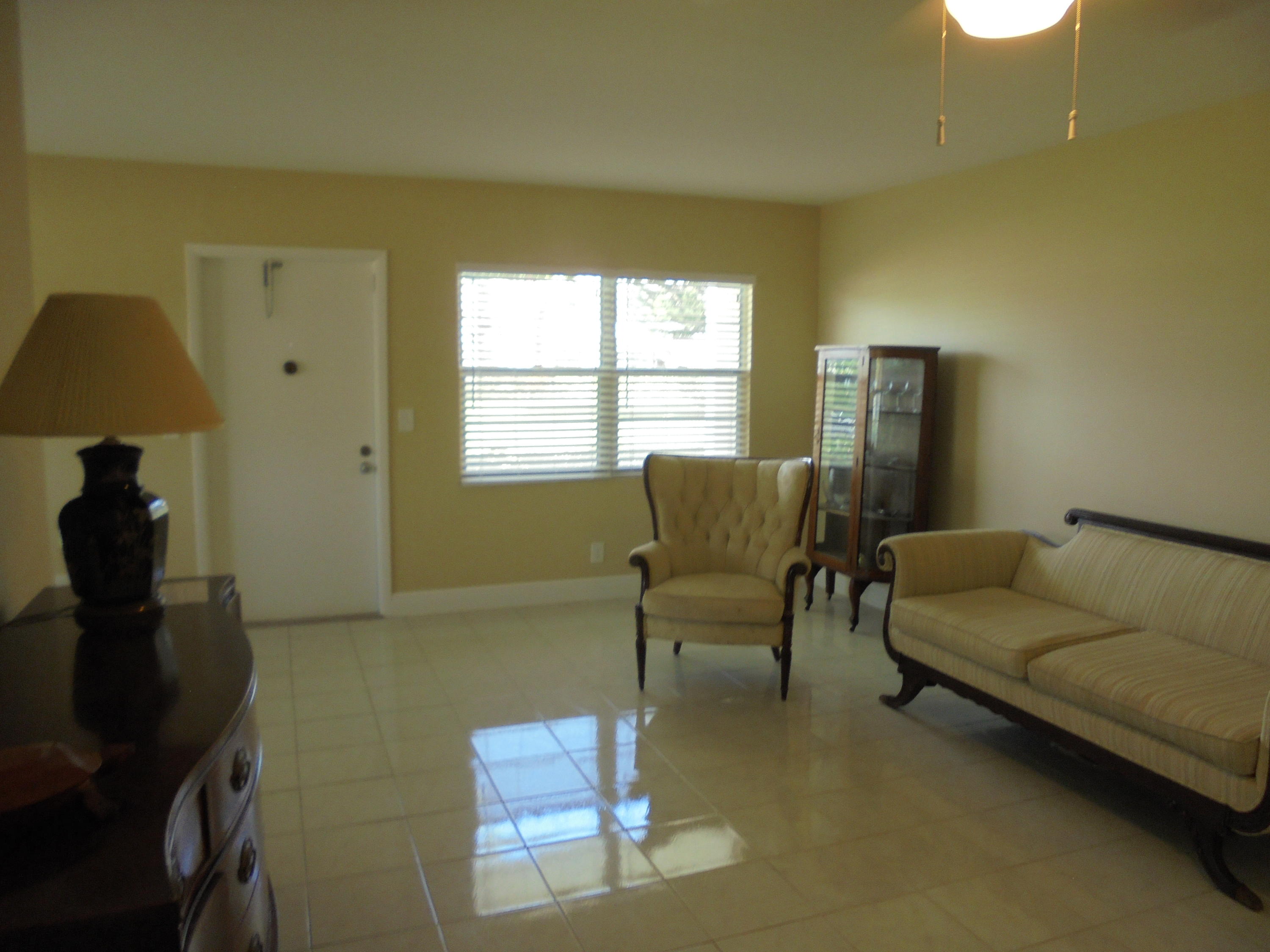 98 Fanshaw C Boca Raton, FL 33434 - Photo 4 of 11 a living room with furniture and a window