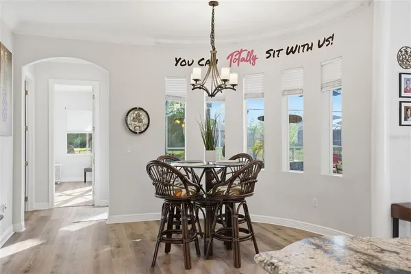 a view of a dining room with furniture and window