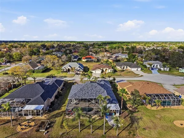 an aerial view of a house with a ocean view