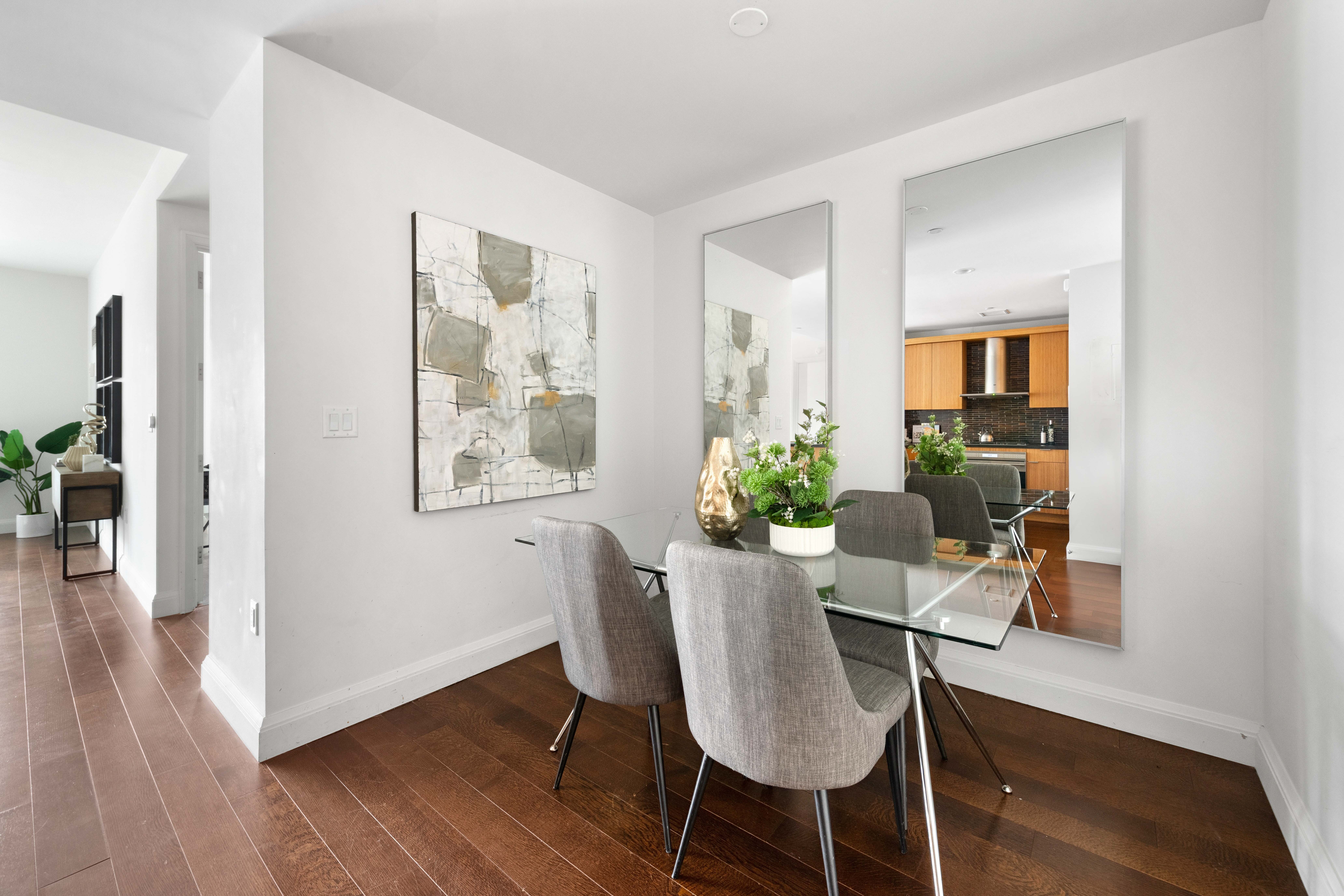 70 Little West Street, Unit 22G Manhattan, NY 10004 - Photo 3 of 13 a view of a dining room with furniture and wooden floor