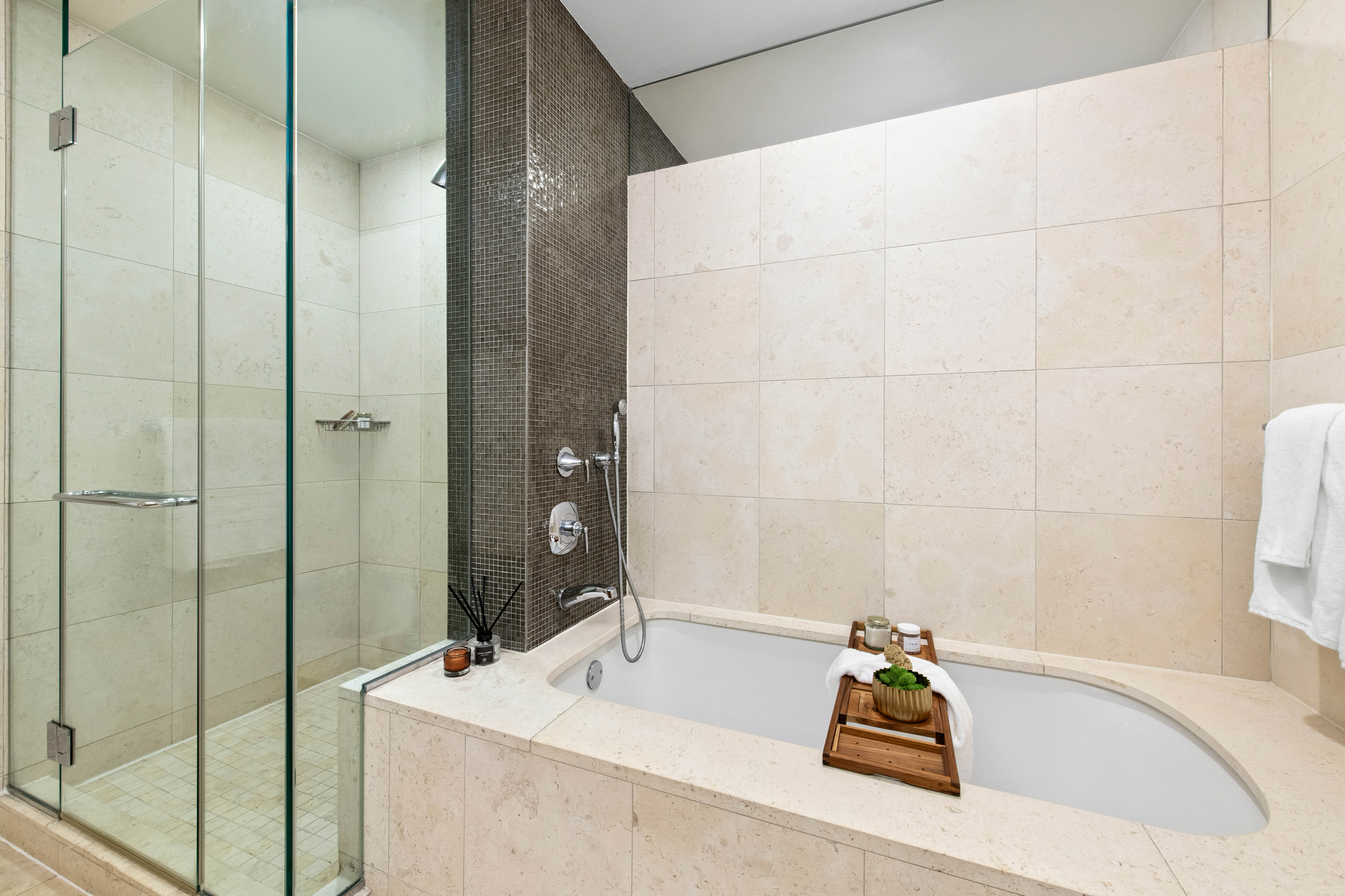70 Little West Street, Unit 22G Manhattan, NY 10004 - Photo 7 of 13 a bathroom with a tub and a sink