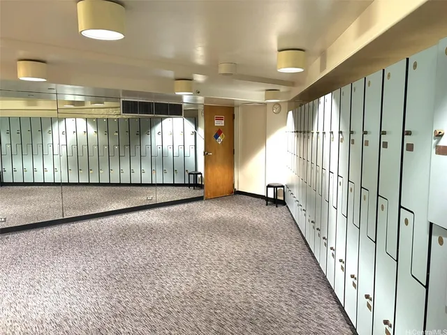 a front view of a house with a yard and staircase