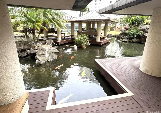 a view of outdoor space with garden and trees