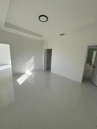 a view of empty room with windows