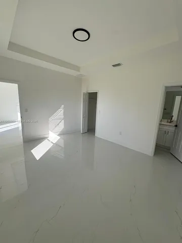 a view of empty room with windows